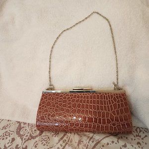 Chic vintage brown faux animal print clutch with silver chain shoulder strap
